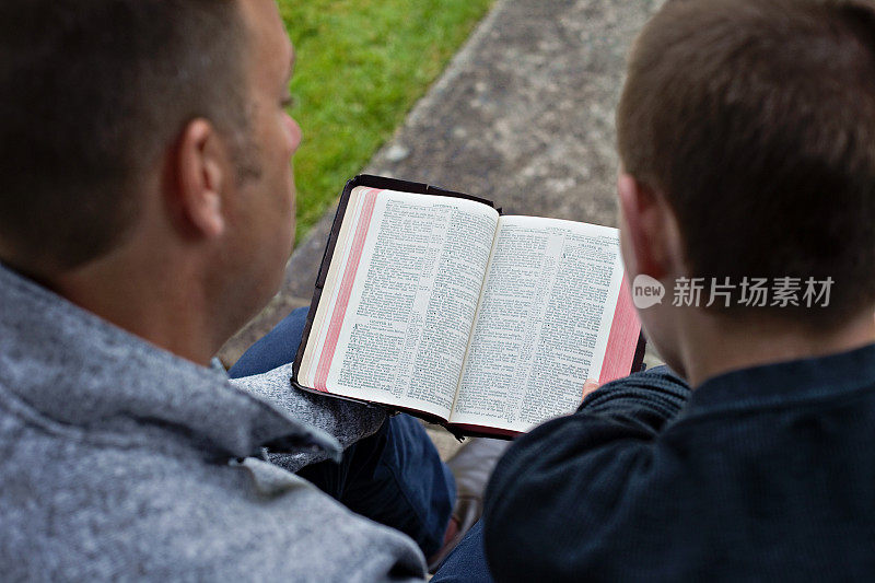 Father and Son with the Bible